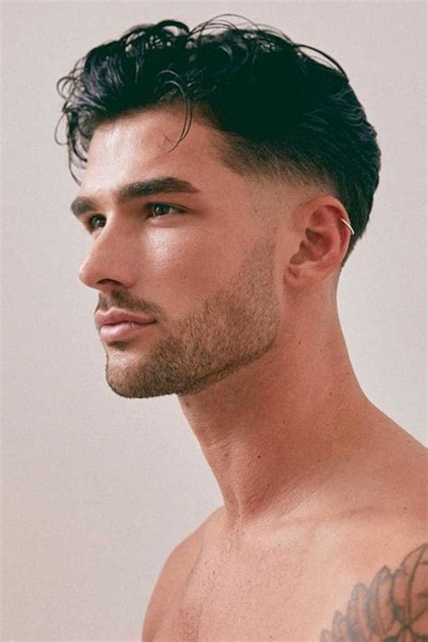The Ivy League is a classic and stylish short haircut for men. . Middle part with low taper